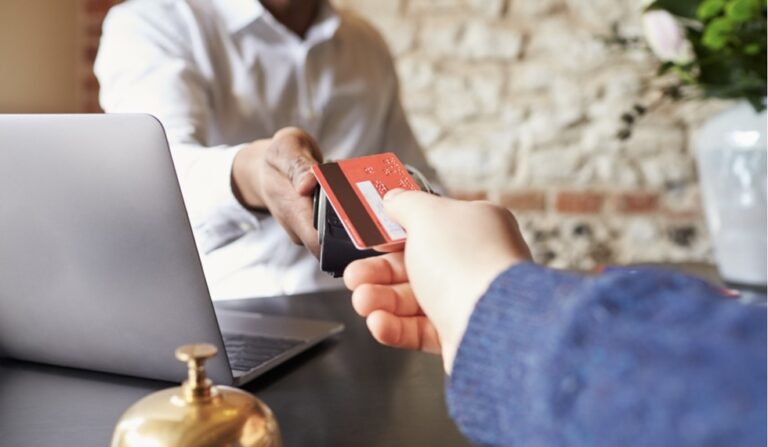 Hand applying credit card to terminal