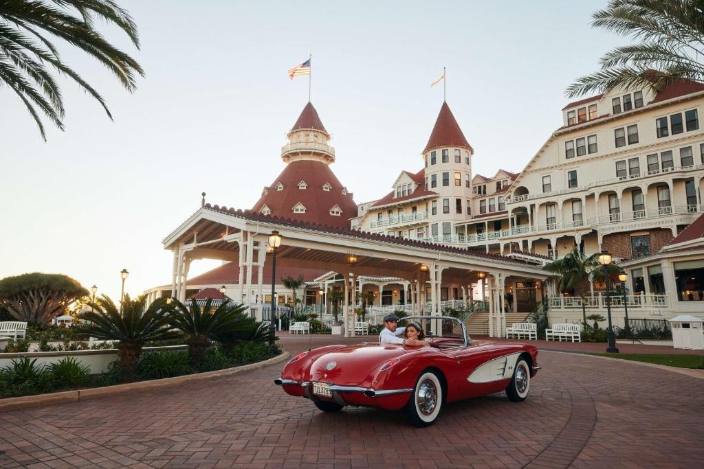 Red car in front of the Hotel Del Coronado